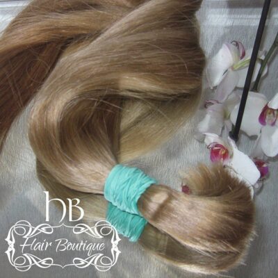 Slavic natural cuts of hair from one head painted in blond tones and blond